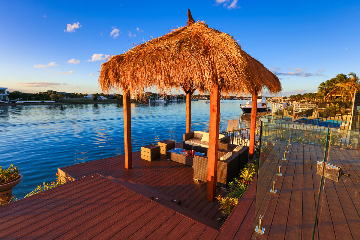 river side home backyard decking and a cabana