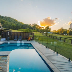 decking around a pool, balloons and sunset view