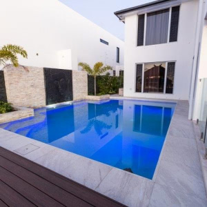 composite decking near a blue-ish pool